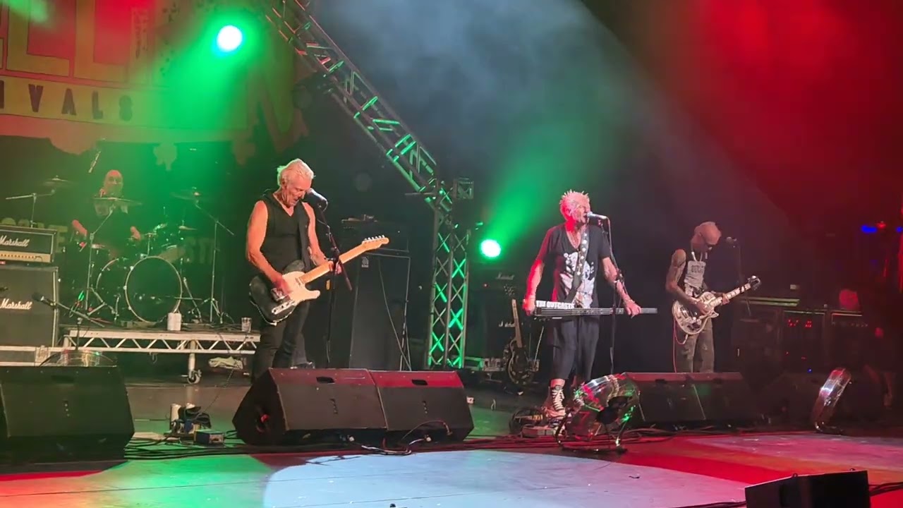 The Outcasts at Rebellion on the Opera House stage playing 'The Cops Are Coming' on Fri. 8/8/25.