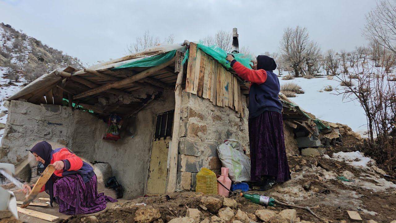 A beautiful day in the snowy mountains. The simple life of Farideh with her daughter.