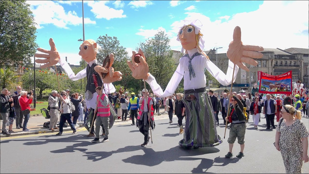 2024 Sma’ Shot Day annual Parade through Paisley town centre in Scotland with giant puppets