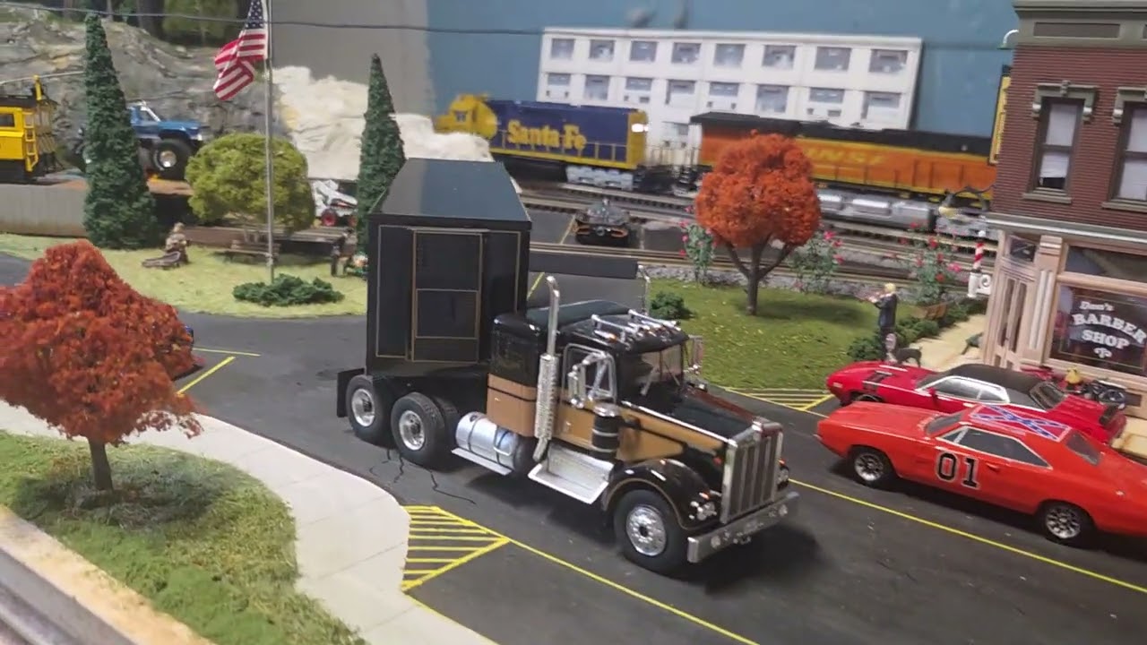 Mixed legacy engine's ride around the layout on a rainy Sunday afternoon. 