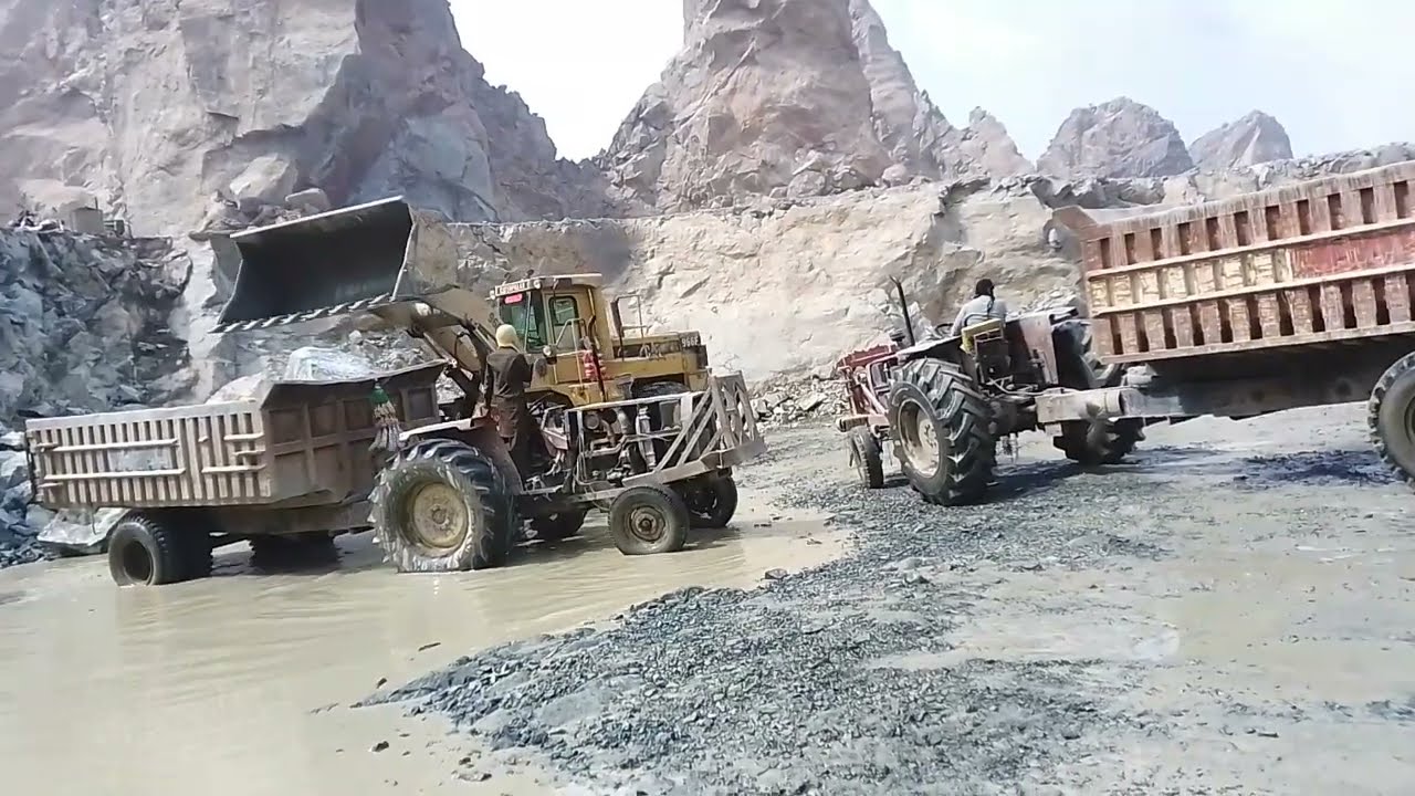 Witness Mountain Power Caterpillar 966F Wheel Loader in Action  Heavy Machinery Conquering Big Rocks