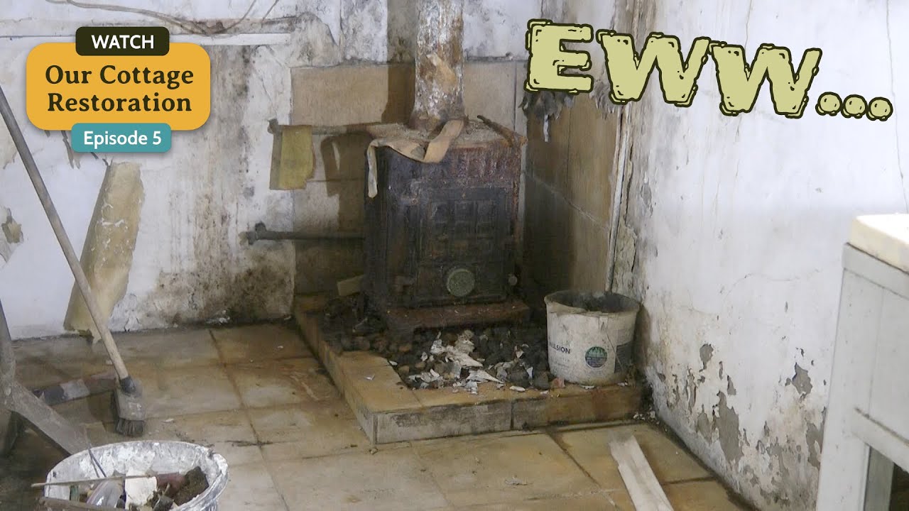 Man cleans a very unpleasant old kitchen in a derelict house