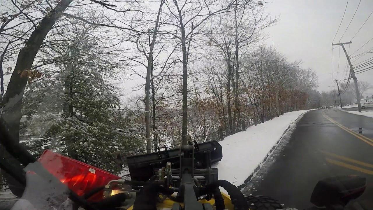 Plowing sidewalk with Wacker Neuson 550 loader and Kage plow