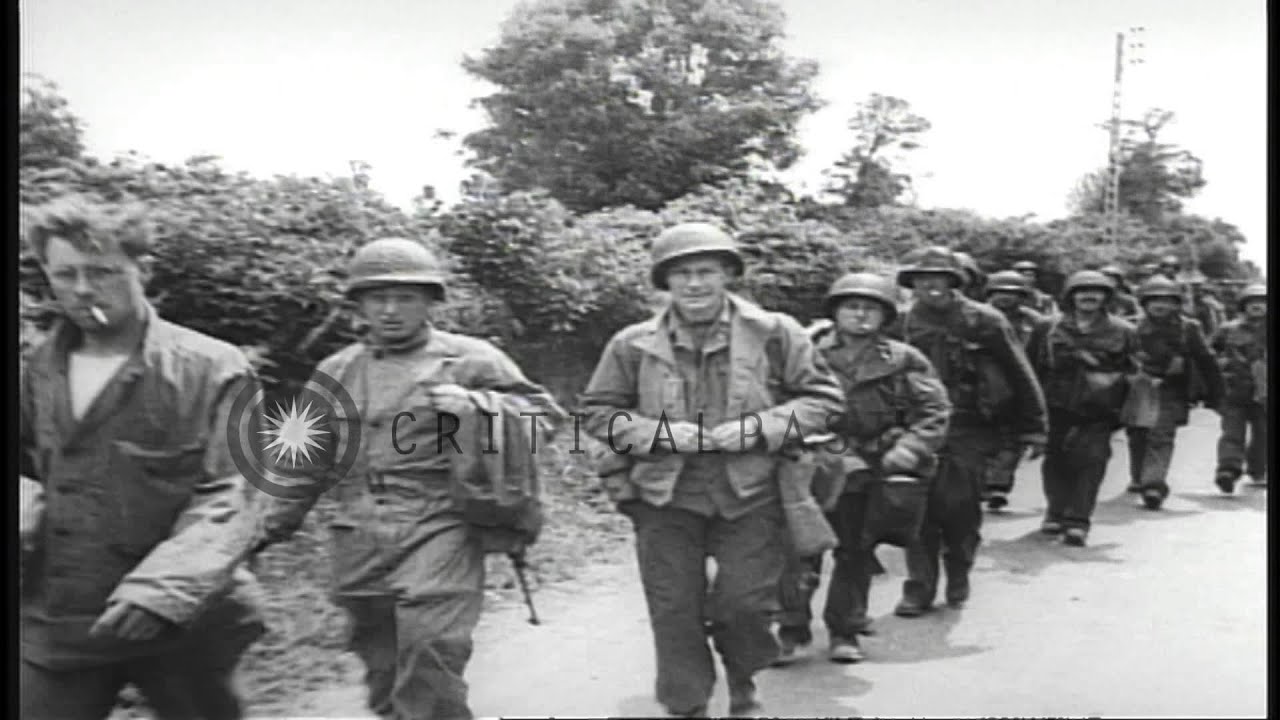French civilians greet U.S. Army entering Sainte-Marie-du-Mont during World War...HD Stock Footage