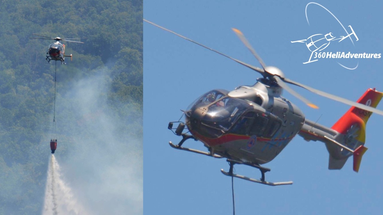 EC135 battling wildfire between the hills