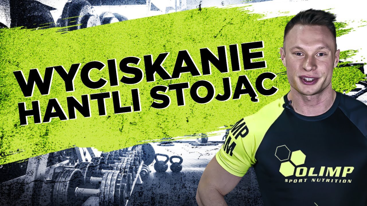 Ćwiczenie: Wyciskanie hantli stojąc - Atlas ćwiczeń - Michał Wrzosek by Olimp Sport Nutrition