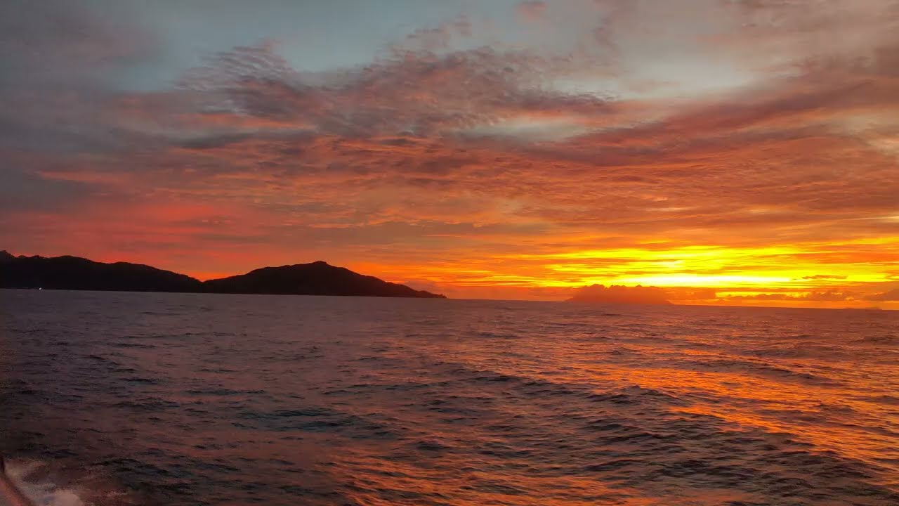 Mesmerizing Sunset at Sea: A Serene Ferry Ride Experience