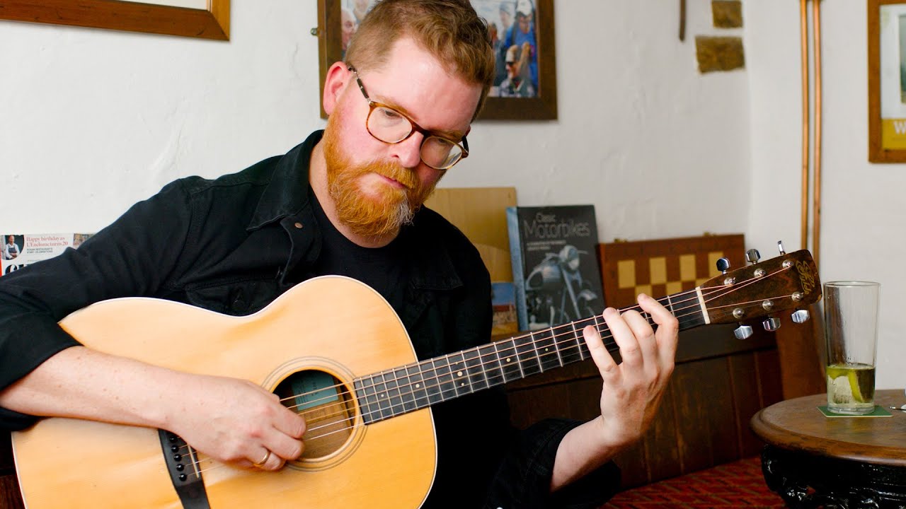 John Smith plays Bert's guitar
