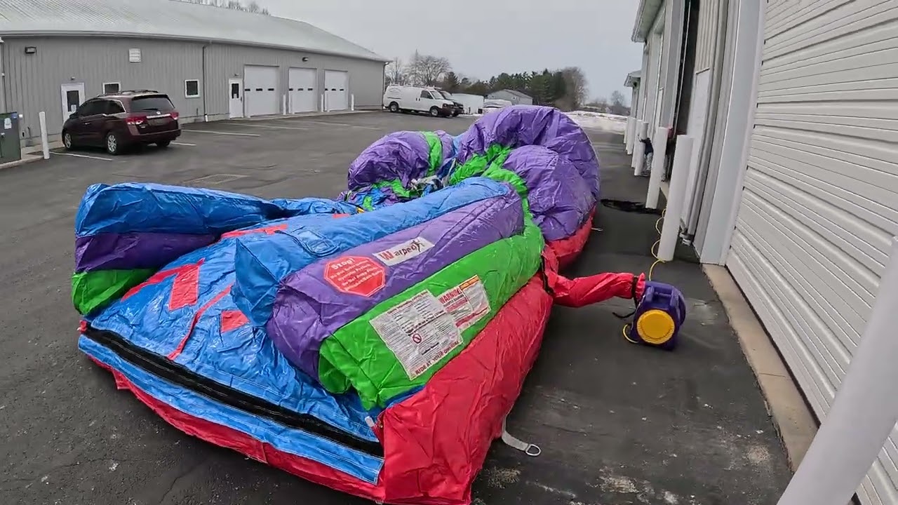 Blowing up our new warped wall rockclimb from Hec worldwide inflatables 