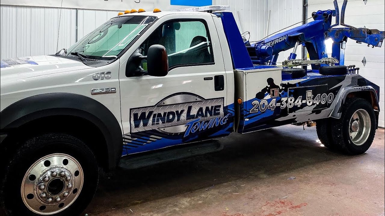 Wrapping a Tow Truck with a custom printed wrap.