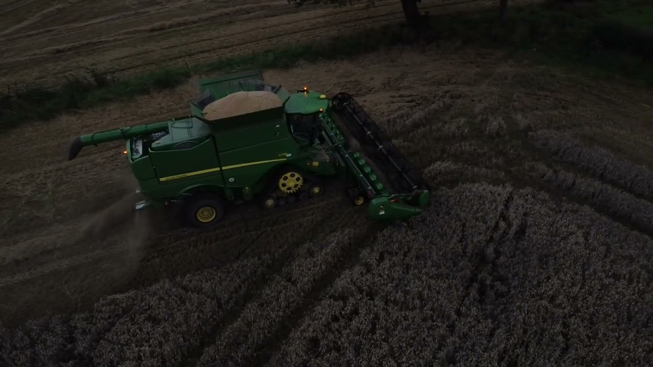 John Deere combine on a damp evening in August