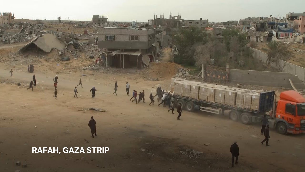 Palestinians in Gaza scramble for aid as trucks drive through Rafah