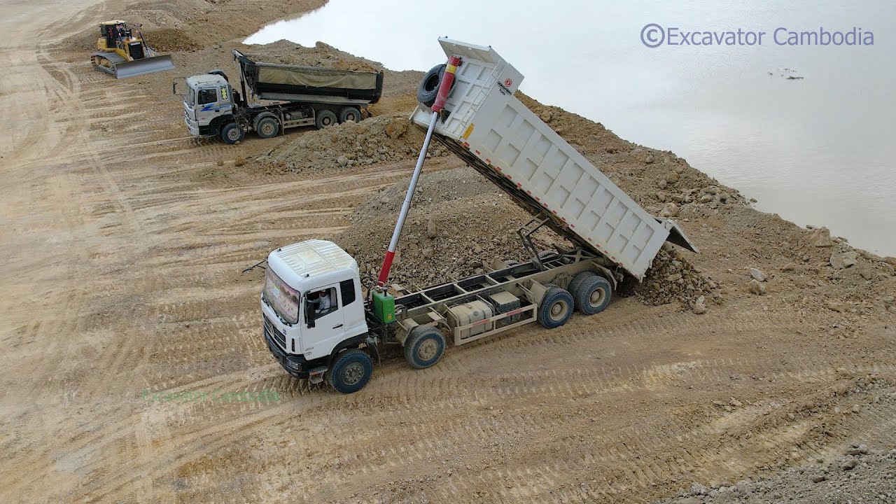 Shantui Dozer Clearing Land - Dongfeng dump truck dumping dirt - អាប៊ុលសាន់ធុយរុញដី