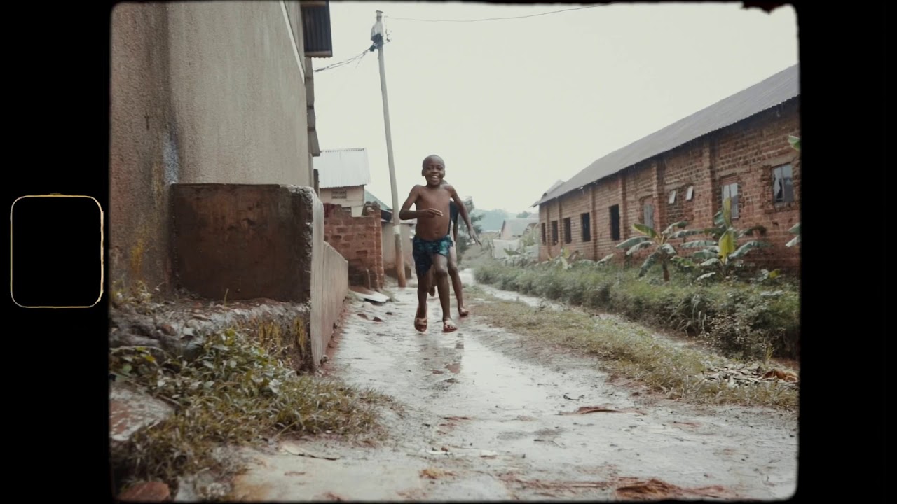 African kids dancing in the rain : Kampala Uganda