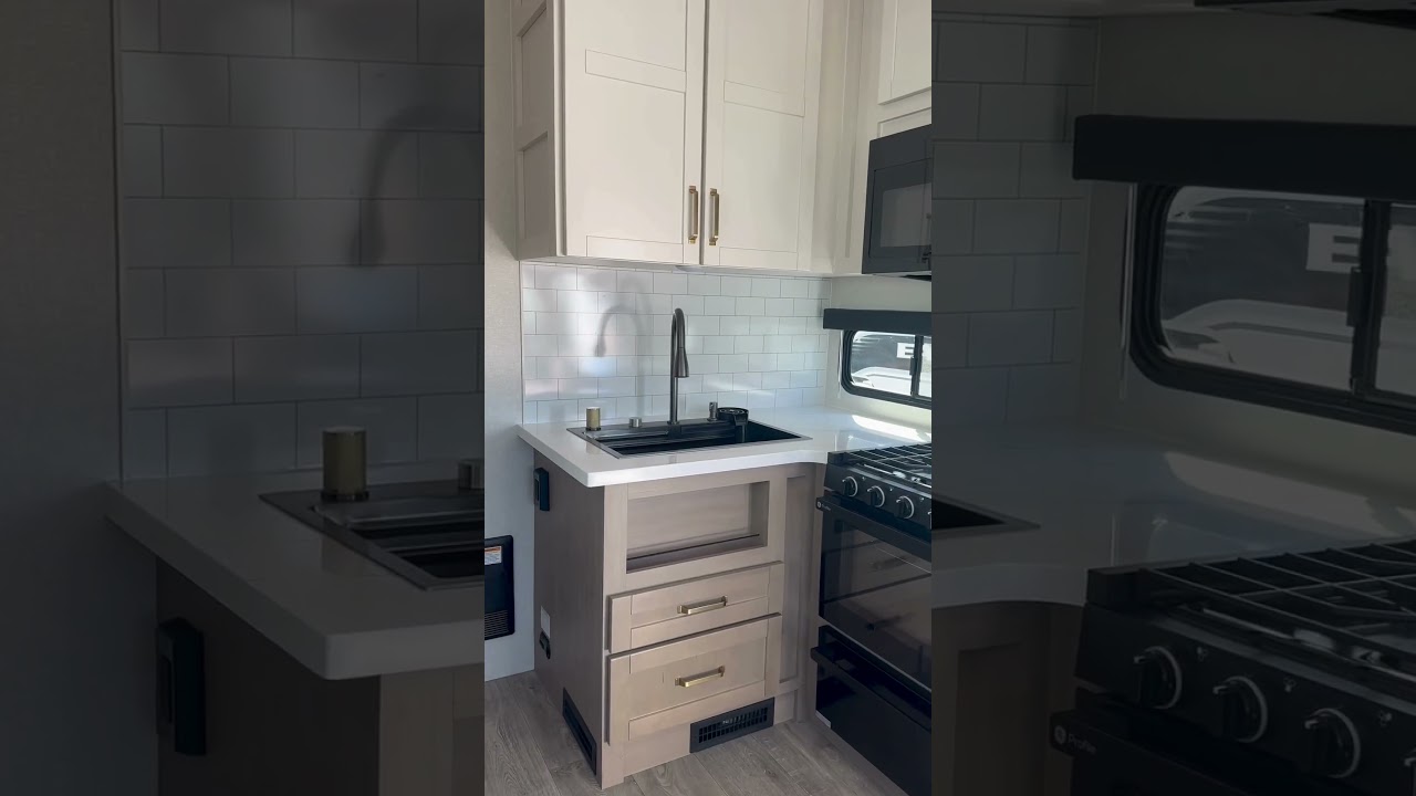 Rear kitchen dreams come true 🍳 Counter space for days + cozy layout. #worldwiderv #rvtour