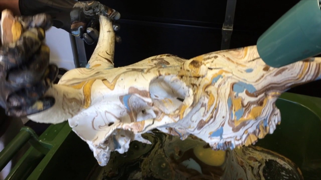 Painting a cow skull using swirling technique