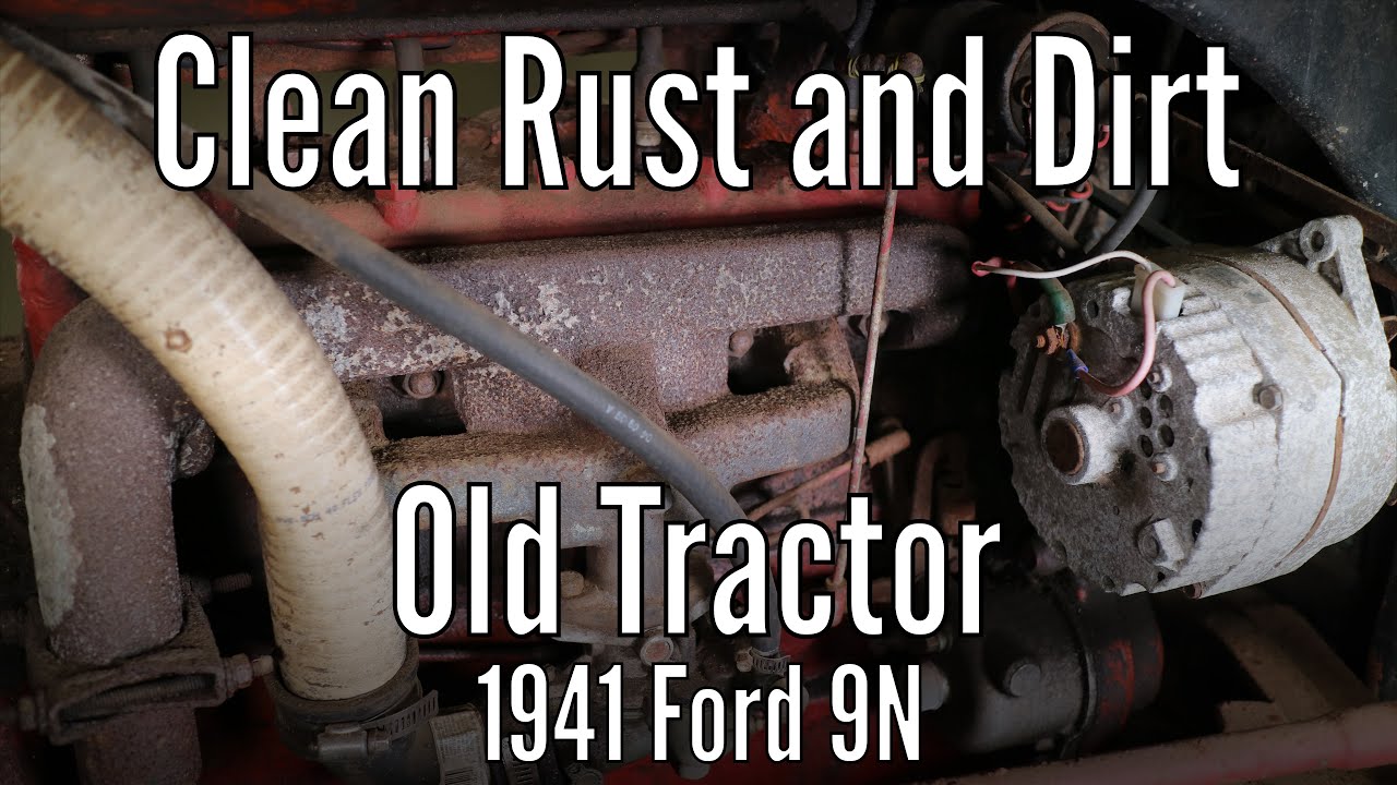 Clean rust and dirt off an old tractor a 1941 Ford 9N