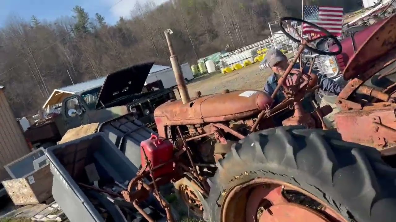 Lot 57 Antique Farmall super C startup 