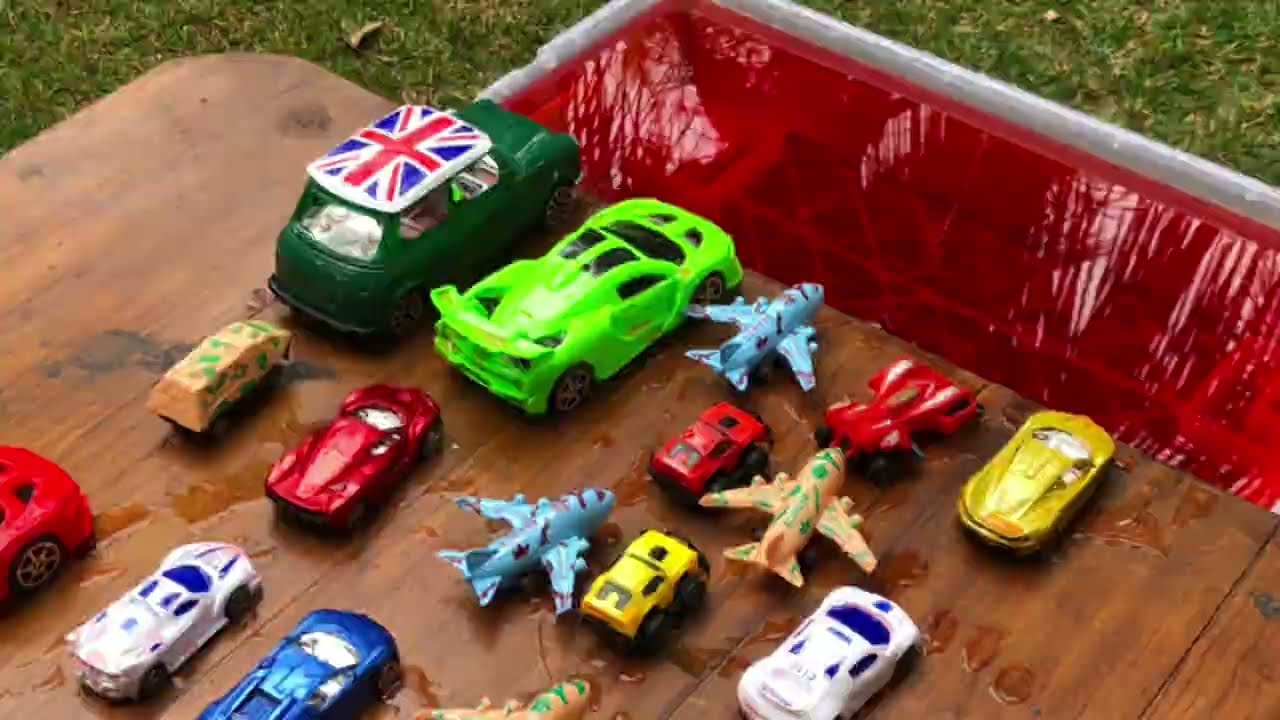 Car Toys Falling Into Red Water