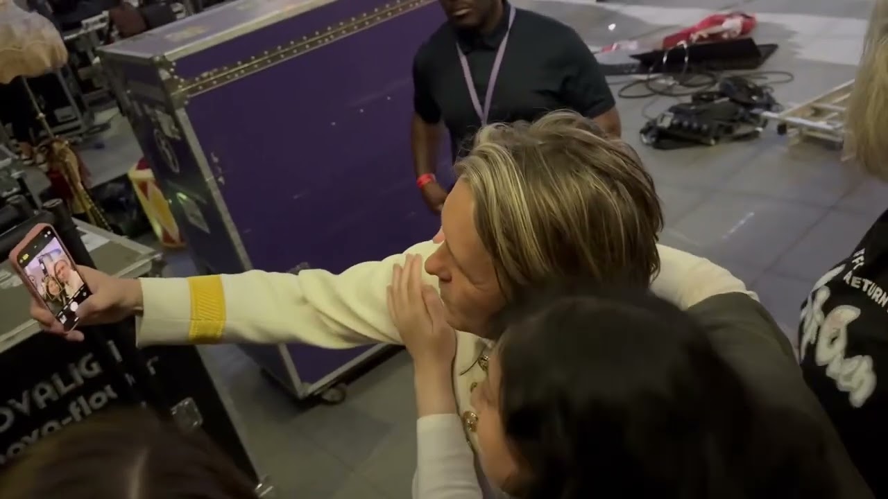 Mark Owen signs autographs...