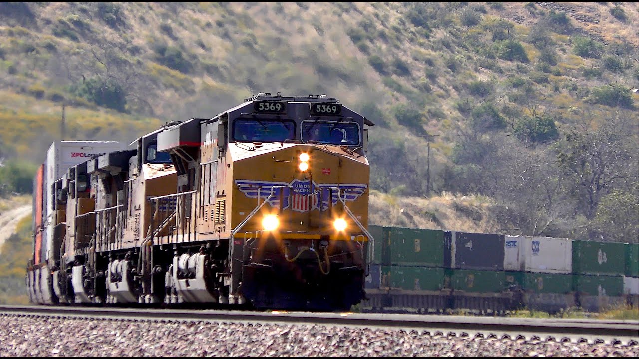 UNION PACIFIC Dynamic brakes hard at work as this 4-header crosses Keenbrook Canyon in Cajon Pass CA
