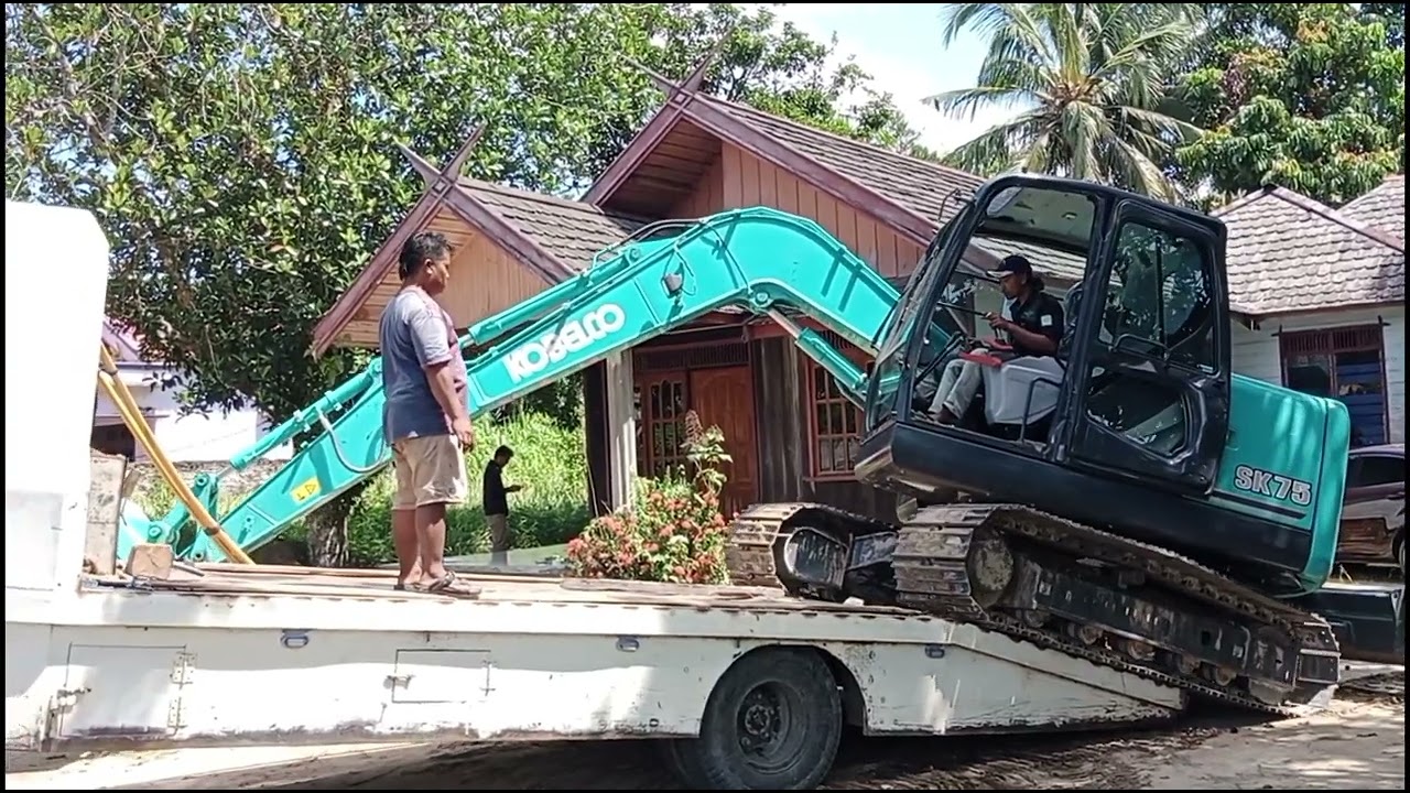 Cara Excavator Sk75 Naik Towing