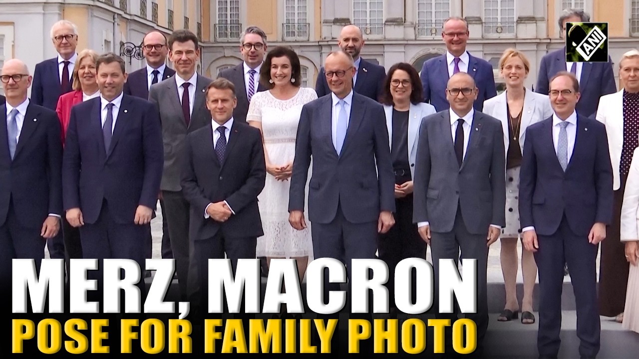 German Chancellor Merz, French President Macron pose with cabinets during official Photo session
