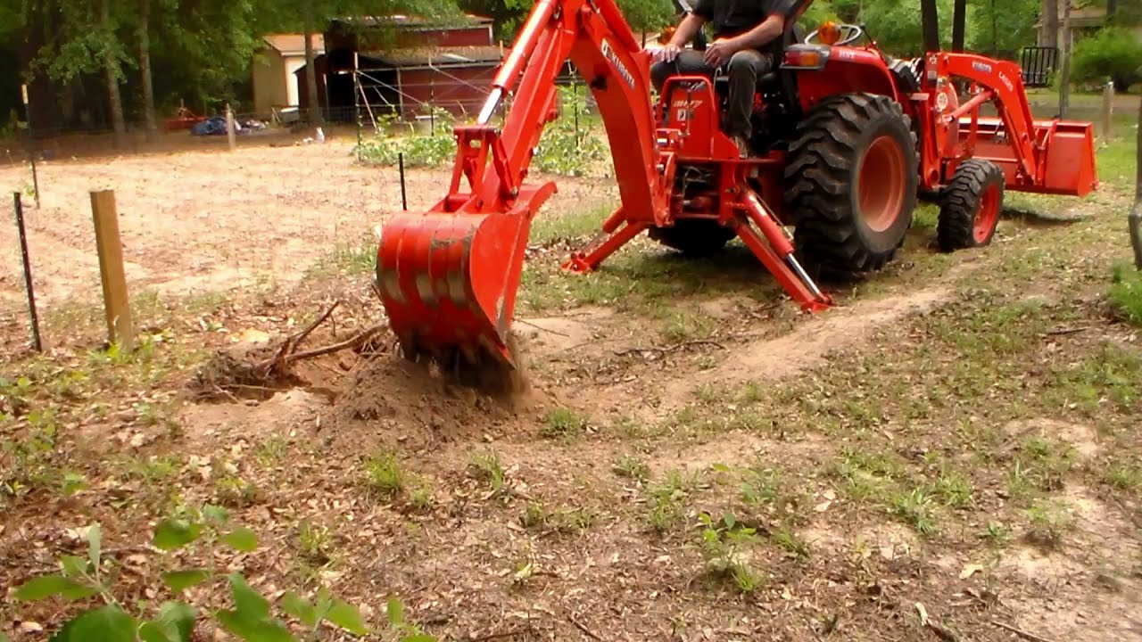 Kubota backhoe digging for water line