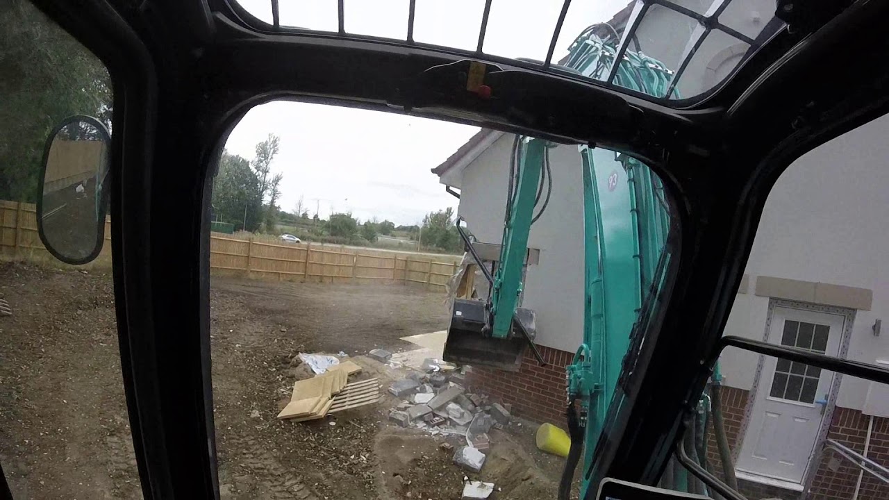 Footage of digger driver destroying £4m homes (Part 1)