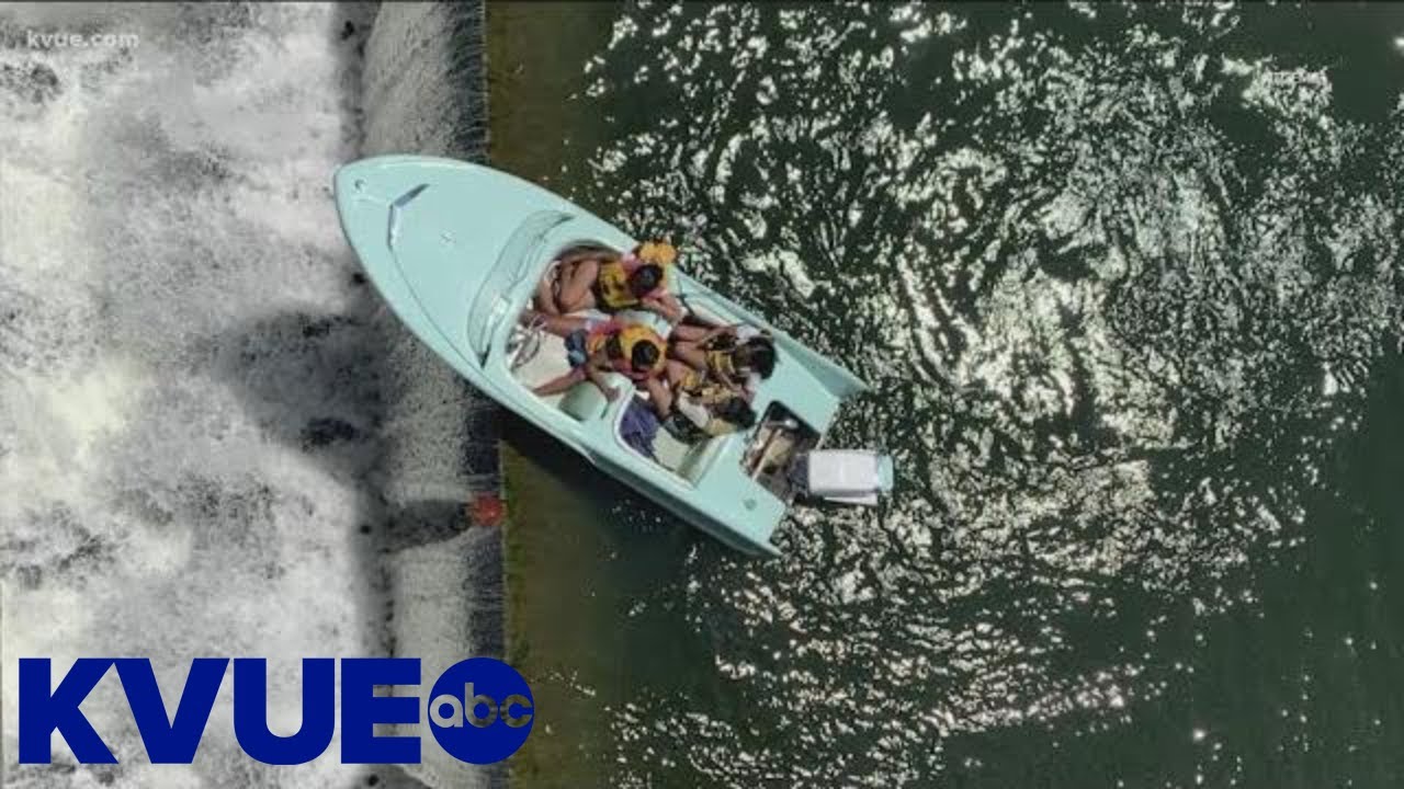 Boaters saved from falling over Longhorn Dam | KVUE