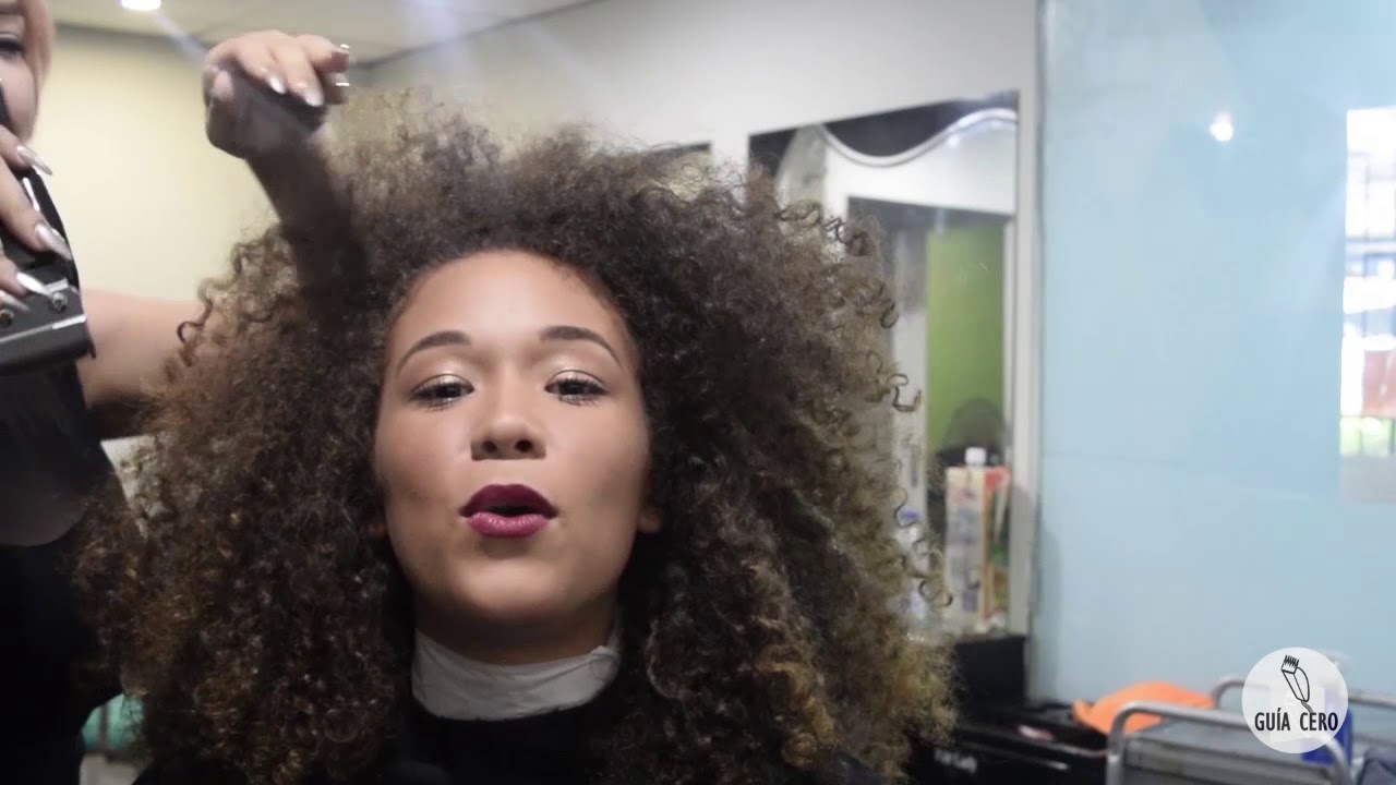 18 Andrea: Long afro to bald