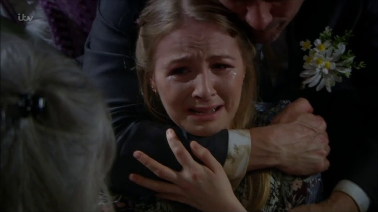 Cain Comforts a distraught Belle
