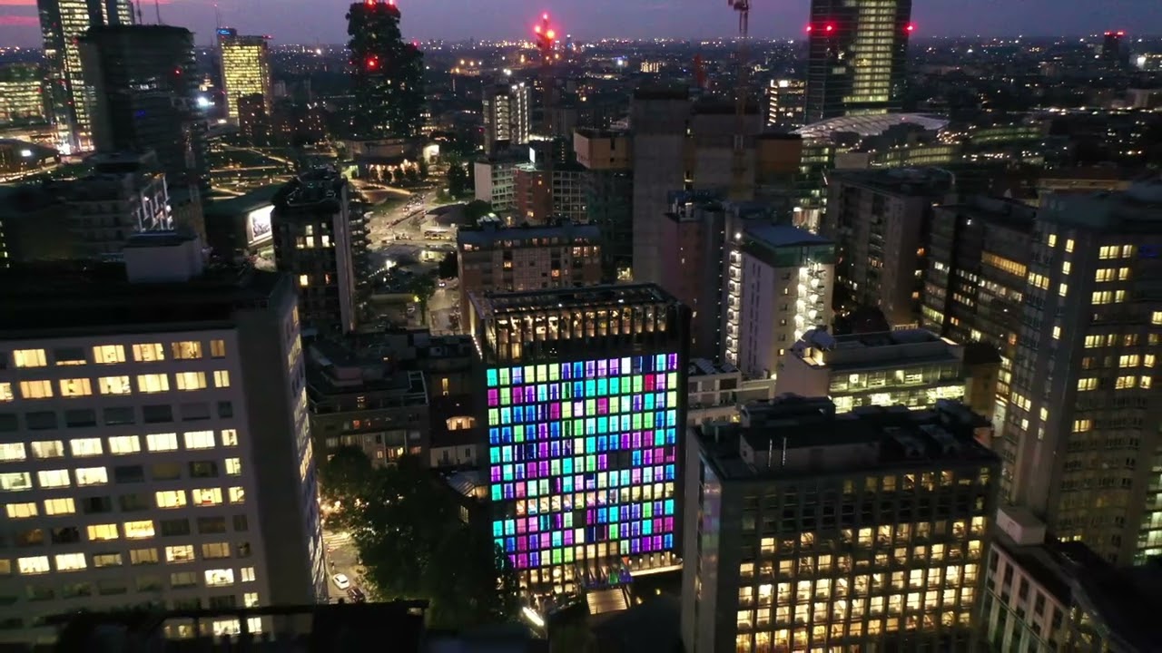 "Stunning Nighttime 4k Drone View of Hyatt Centric Milan Centrale: Illuminated Elegance in Italy