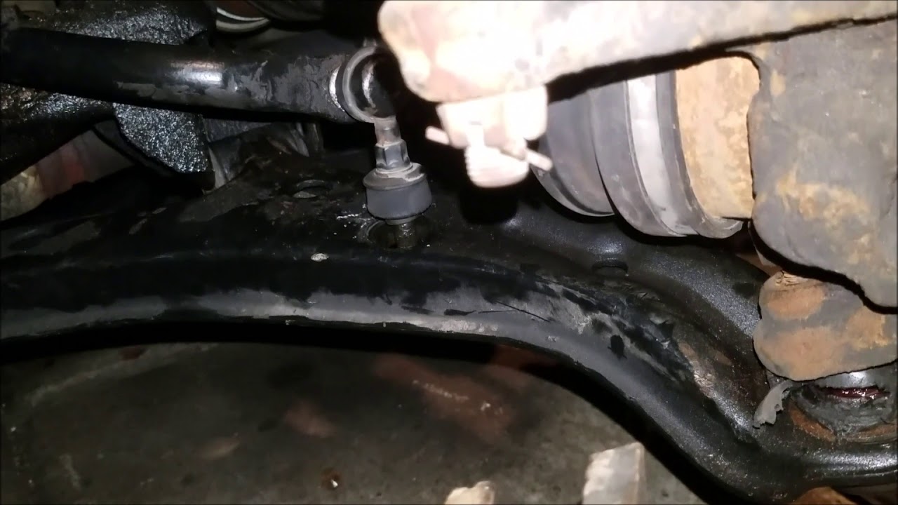 How to replace a front lower control arm on a 2006 Nissan Sentra