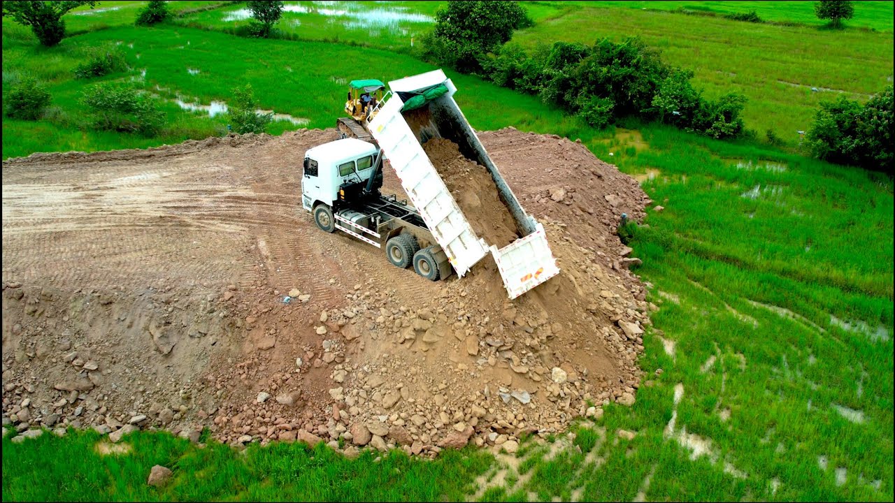 Excellent techniques komatsu dozer pushing stone | dump truck unloading stone