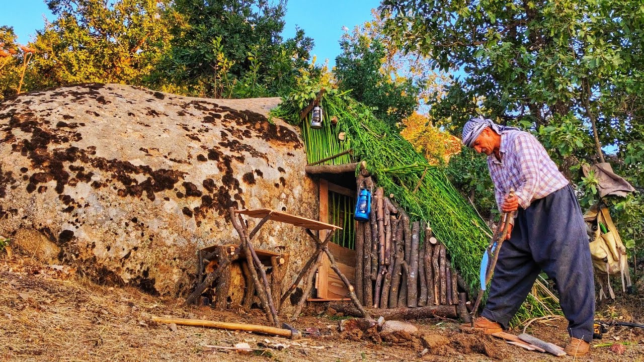 Rockside Refuge: Building a Shelter Seamlessly Attached to a Massive Rock