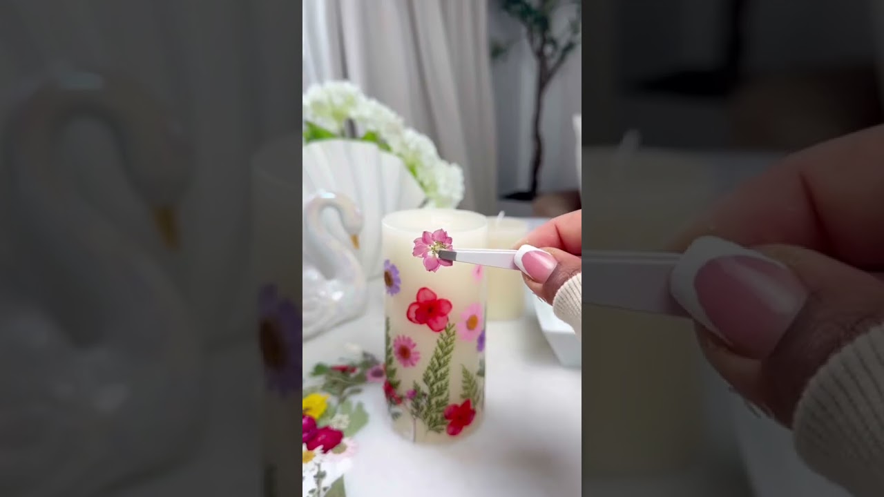 DIY Spring Candles 🌸 All you will need is mod podgy, pressed flowers and candles.
