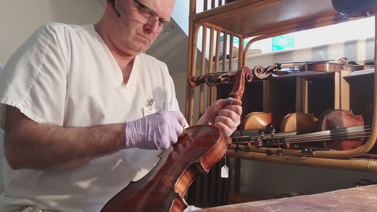 Wesley Baggett French Polishing a new violin.