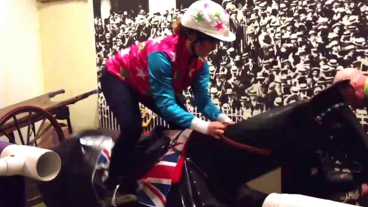 Girl nearly falls off horse racing simulator in New Market