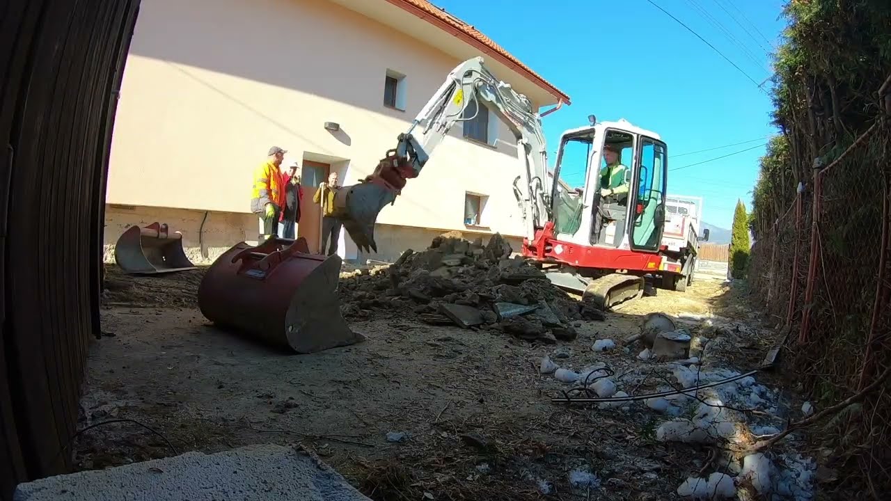 Tearing apart old driveway with Takeuchi TB225