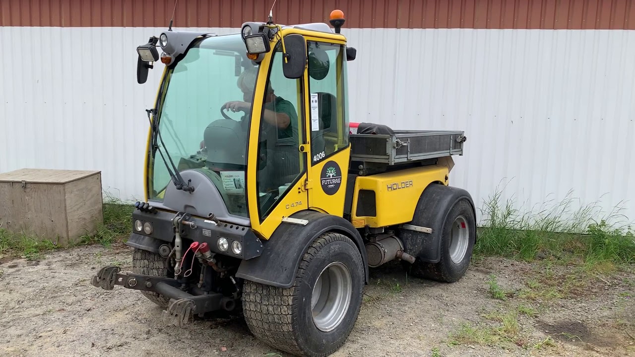 HOLDER C4.74H with tip platform, 1,907 operating hours.