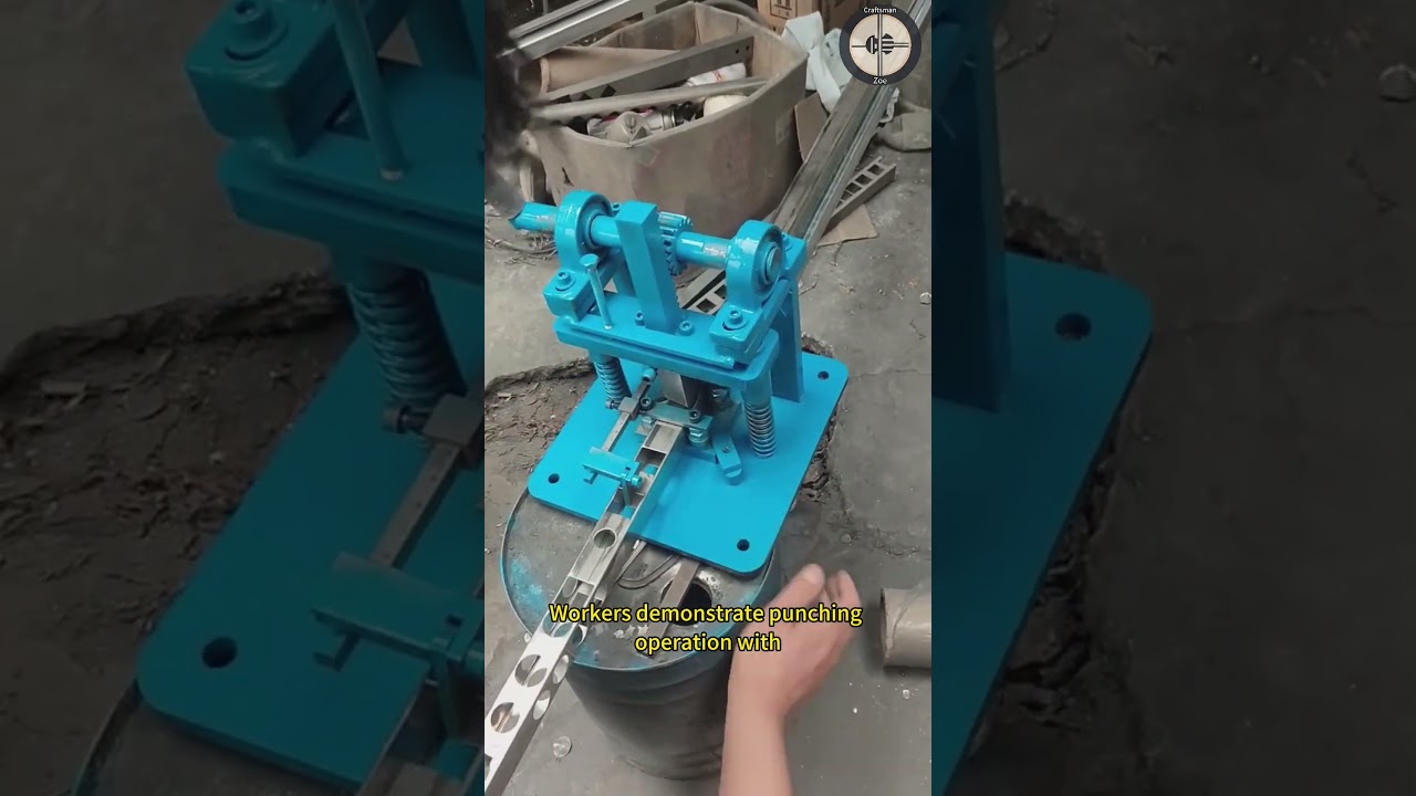 Workers demonstrate punching operation with manual stainless steel pipe punching machine