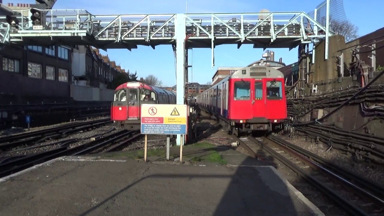 London Underground D Stock 7513 and 7018 + 1973 Stock 879 and 216 at Barons Court