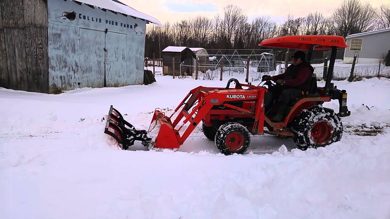 Kubota B1700 with a BOSS UTV 6' Polly snow plow