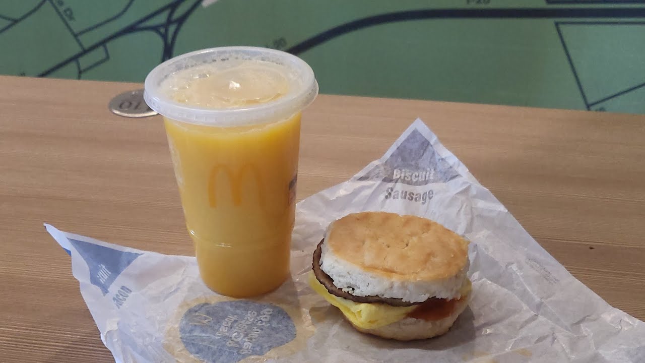 Eating McDonald's new hot honey sausage egg biscuit 