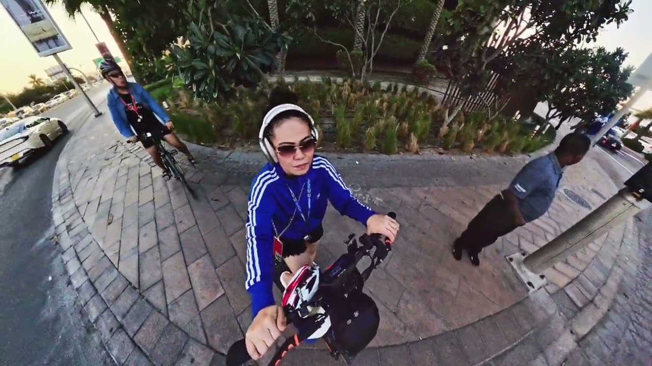 Charie driving scooter going to Jumeirah Public Beach