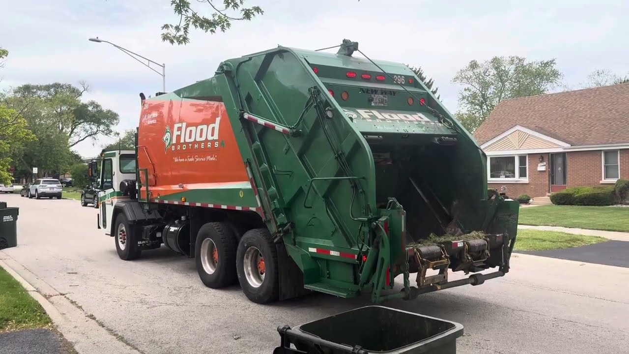 Flood brothers Battle motors new way rear loader garbage truck on carted yard waste