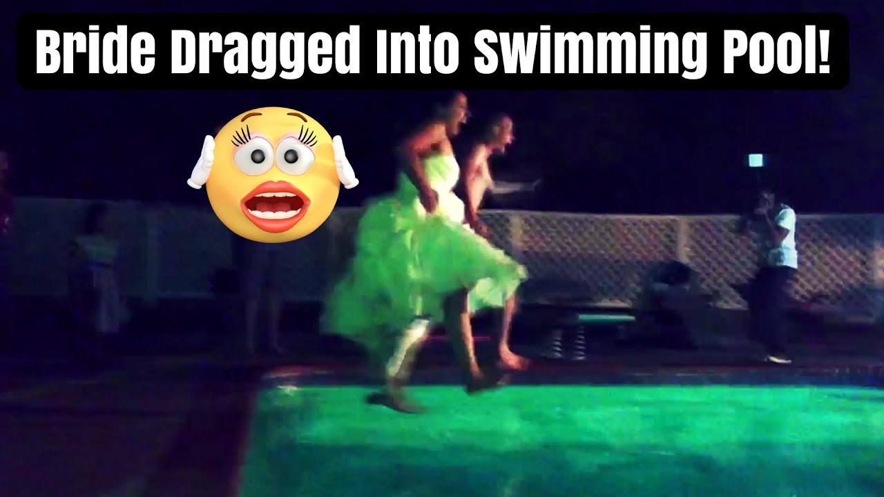 Bride goes into Swimming Pool with her Wedding Dress
