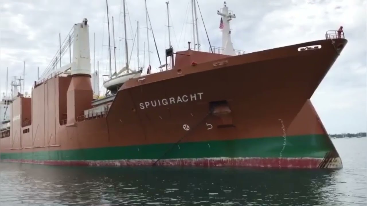 Transportation of oversized cargo by sea. The yacht is loaded onto a cargo ship.