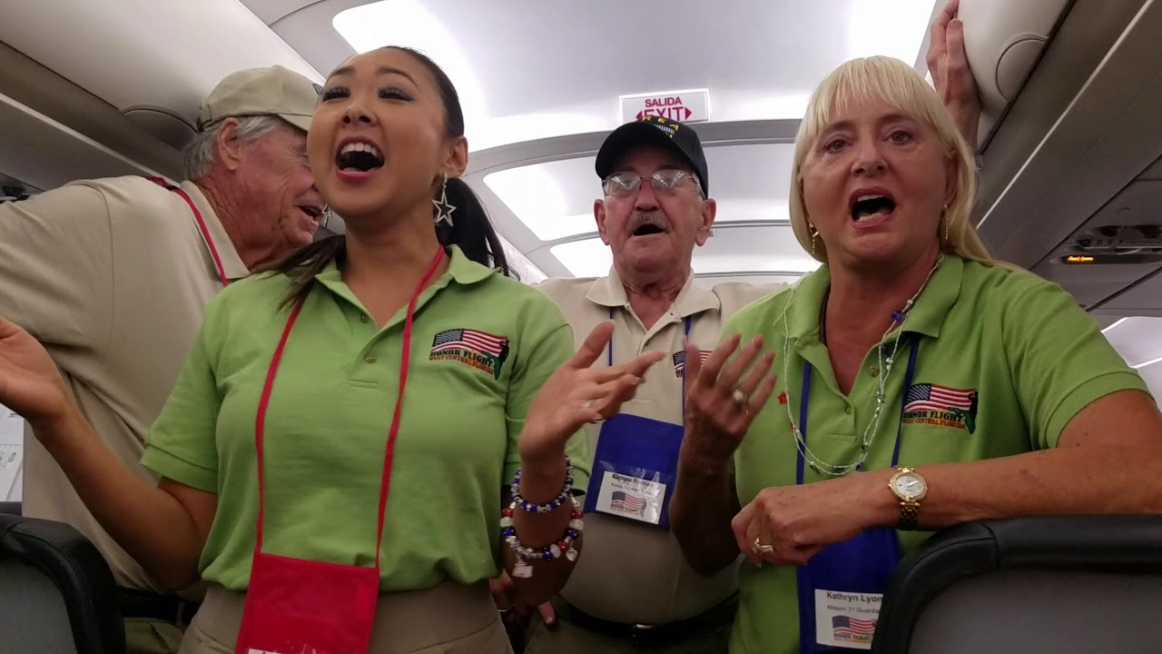 Ann P sings God Bless America on an Honor Flight